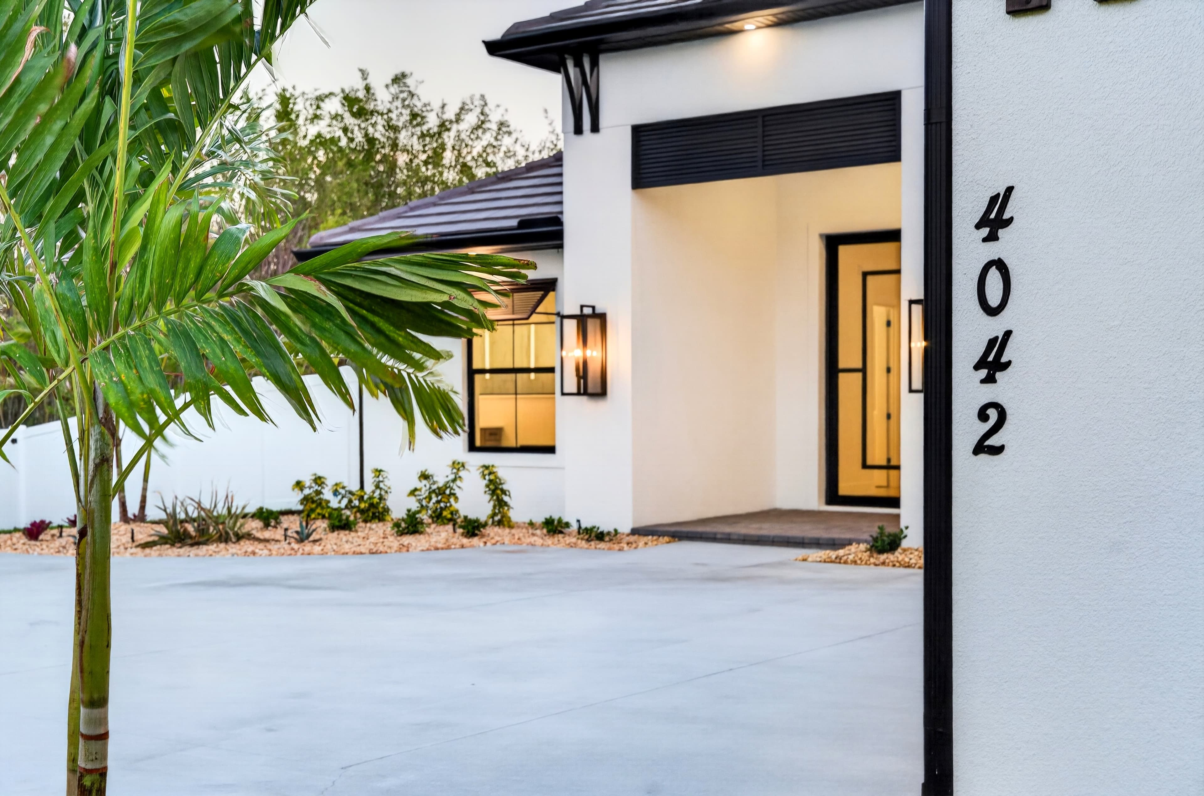 Twilight home exterior with warm interior lights